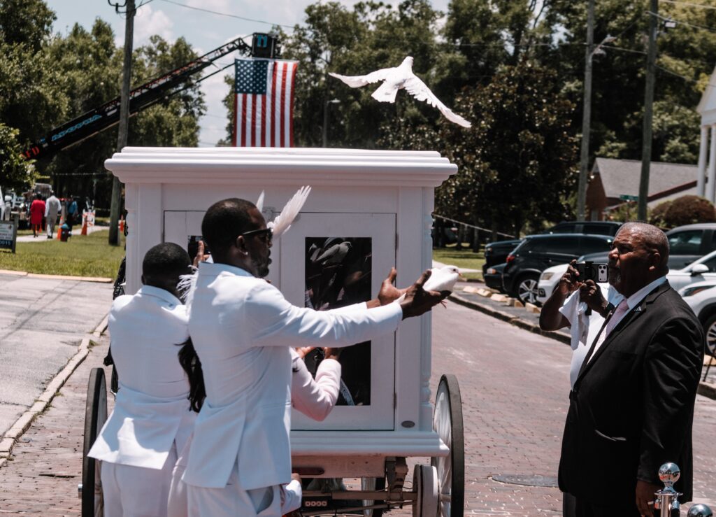 Erick Collington, Mariyah Collington's father, releases a dove at the ceremony.