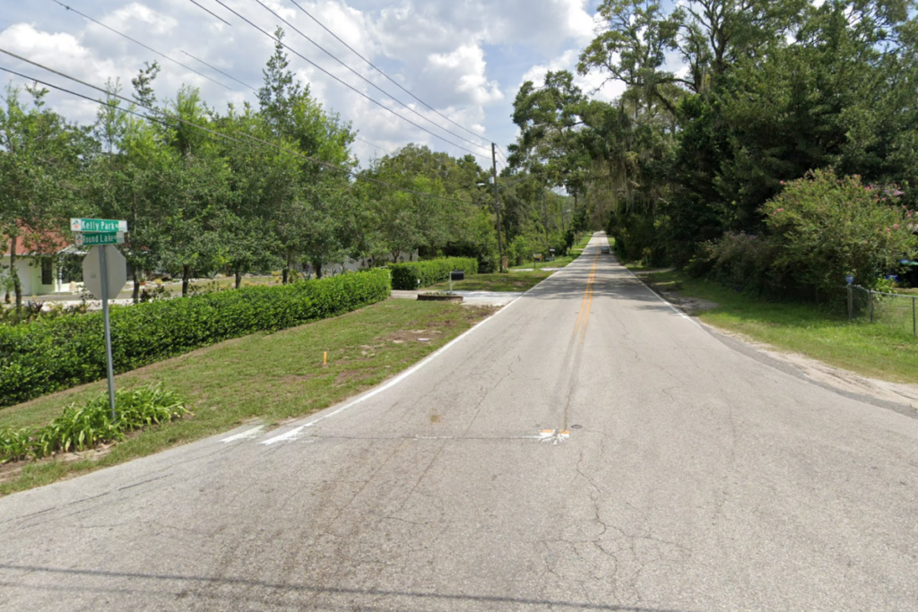 The westward view from Round Lake Road down Kelly Park Road, where a man died in a single-car crash on Sunday.