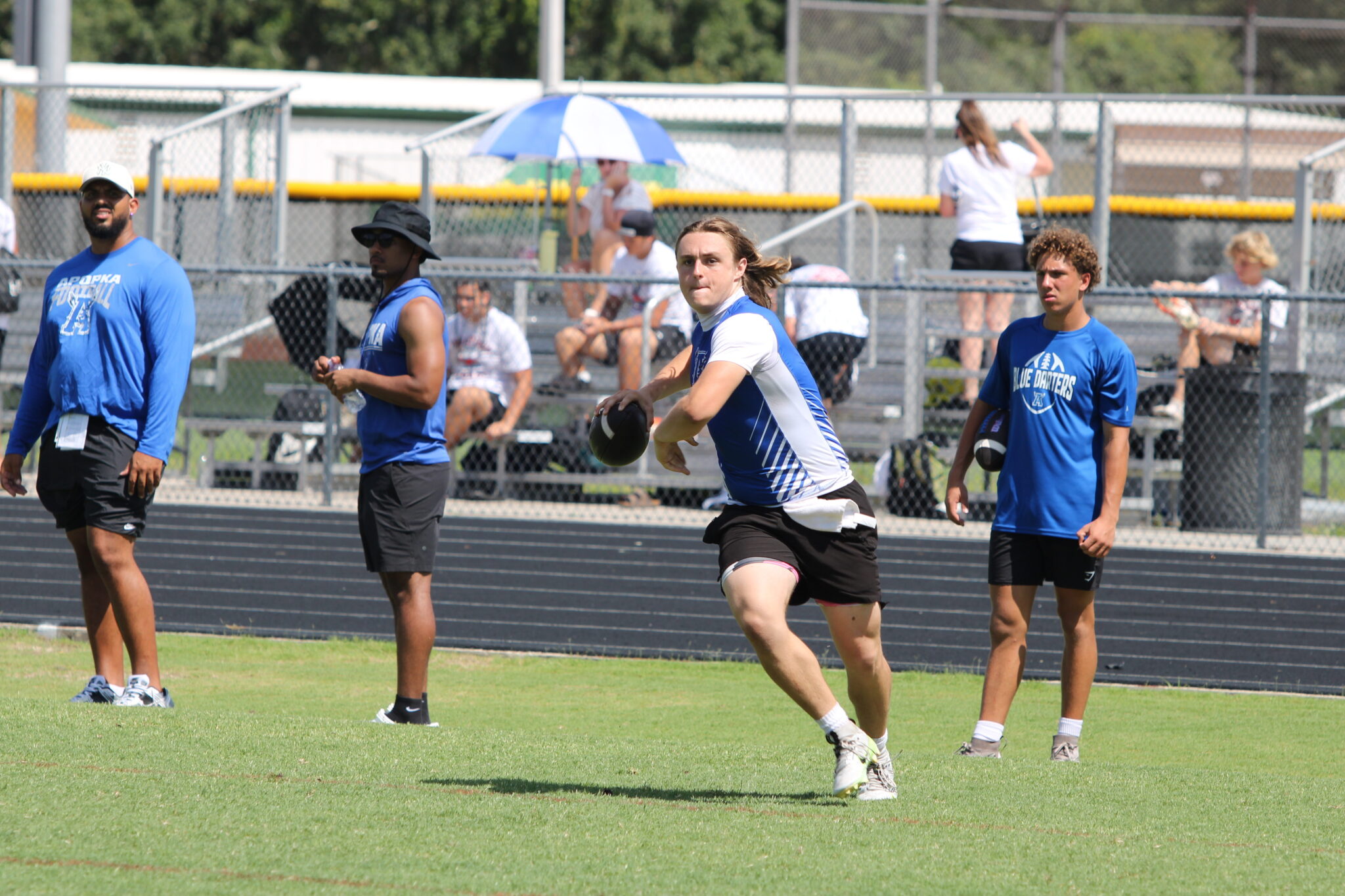 Hunter McNenney makes a throw on the run against Pine Ridge.