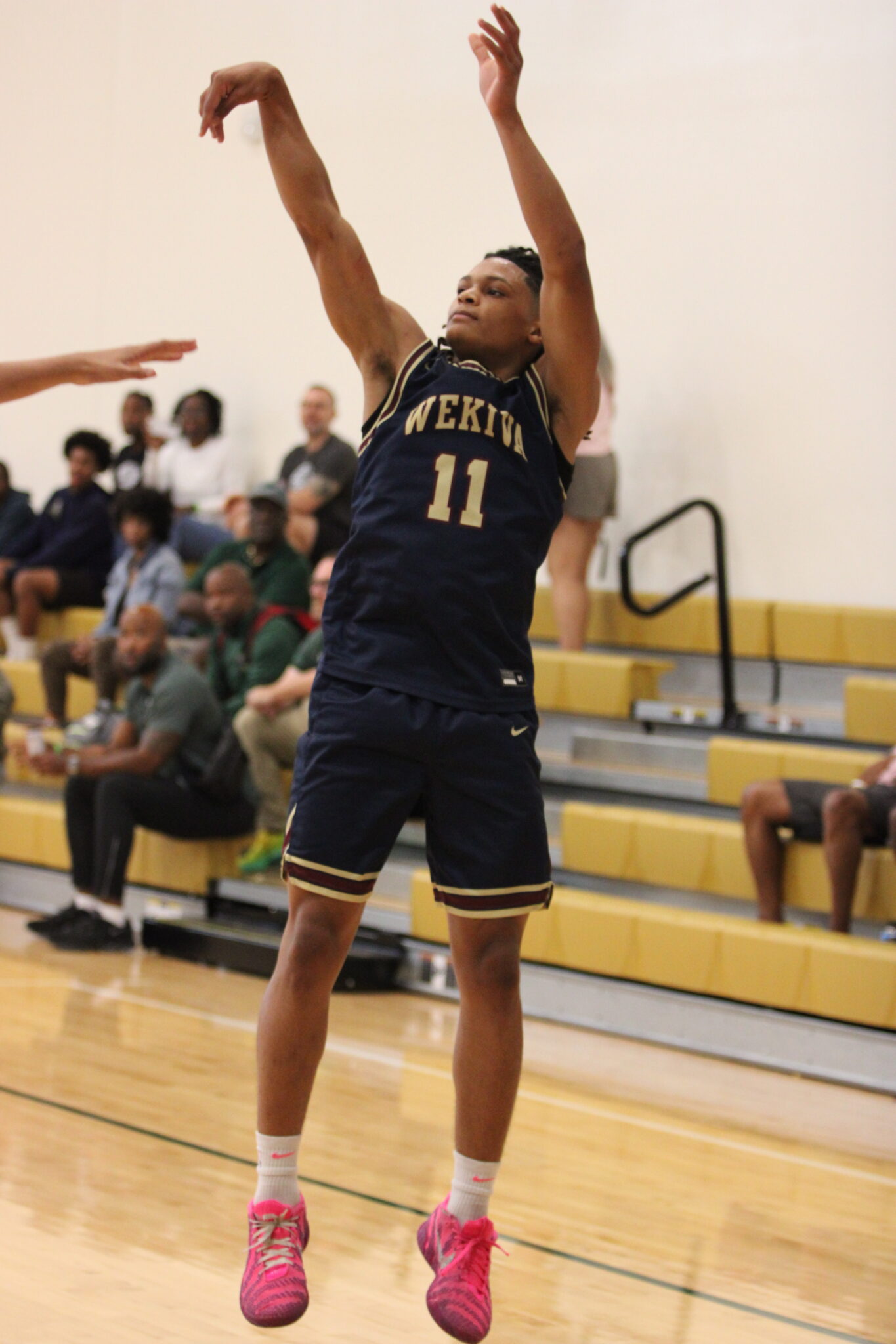 Jace Moore lets a three pointer fly from the corner against Santa Fe.