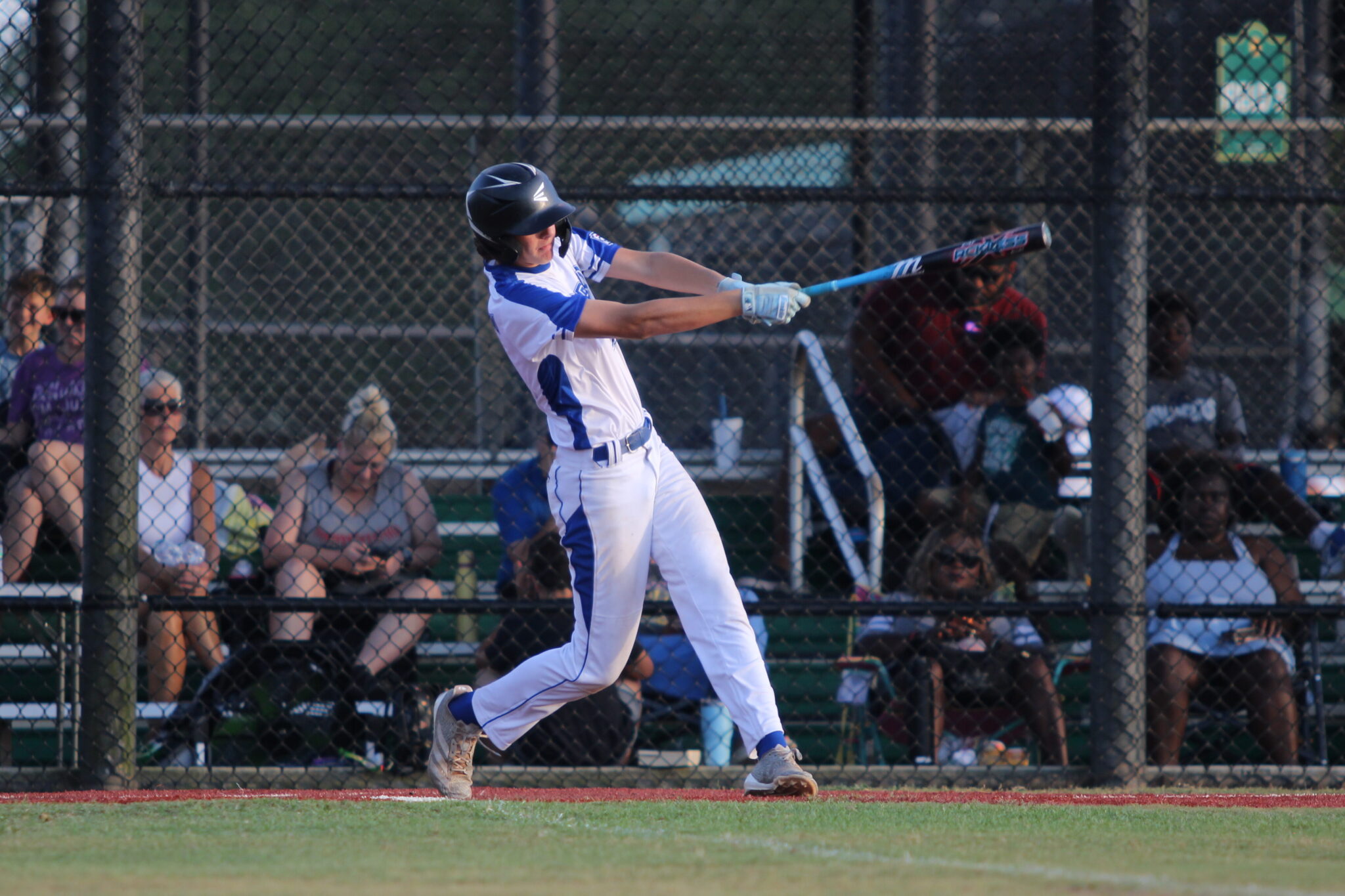 Jackson McMillion rips a ball into the outfield in the third inning.