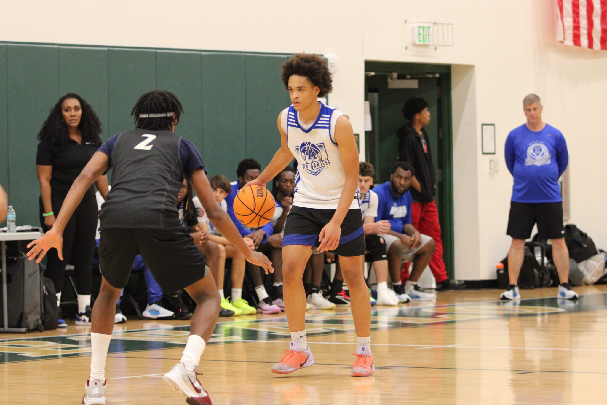 Jaden Andino takes the ball past halfcourt as a play develops.