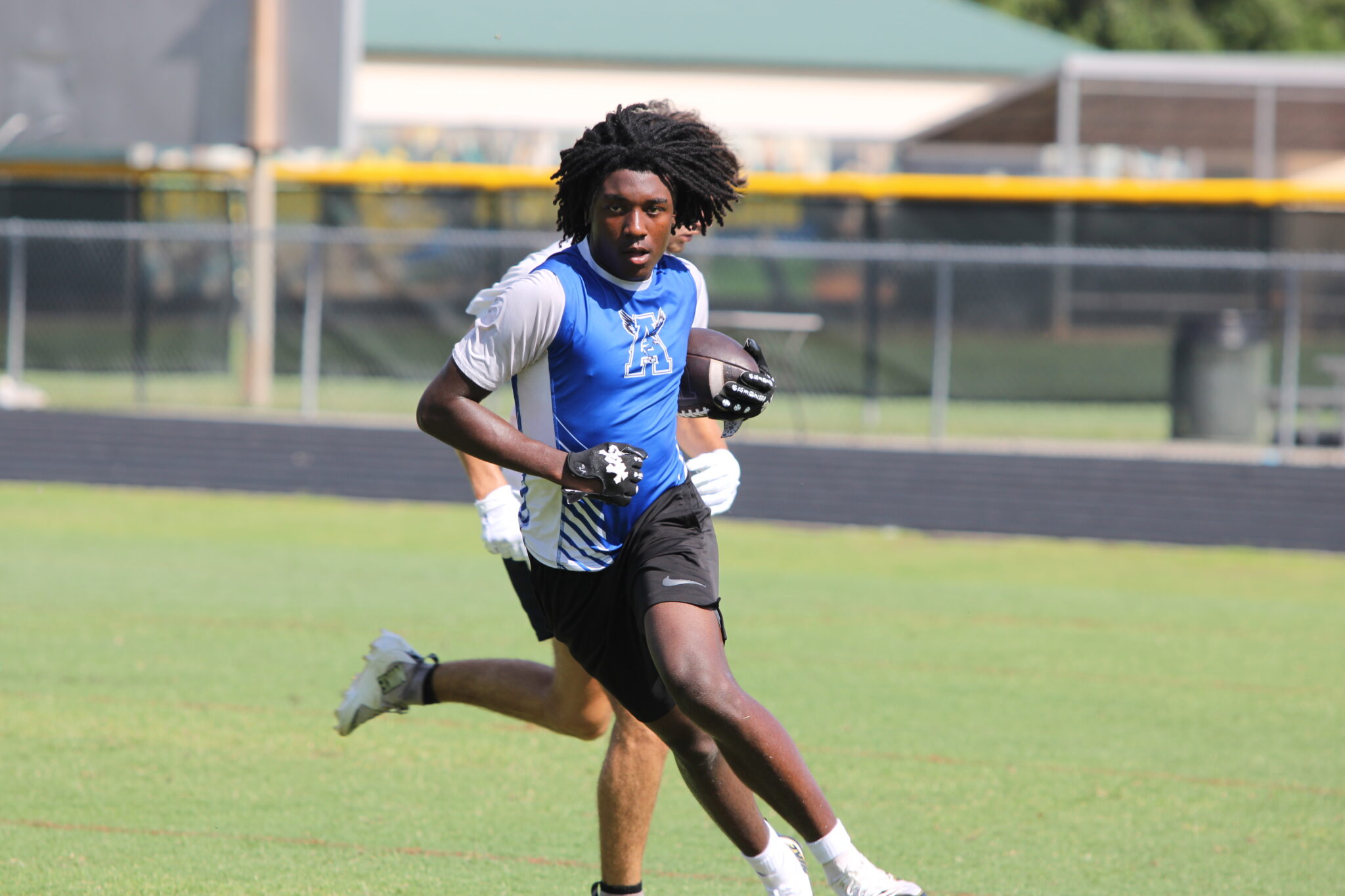 Jaylen Laster makes a catch and run up the field.