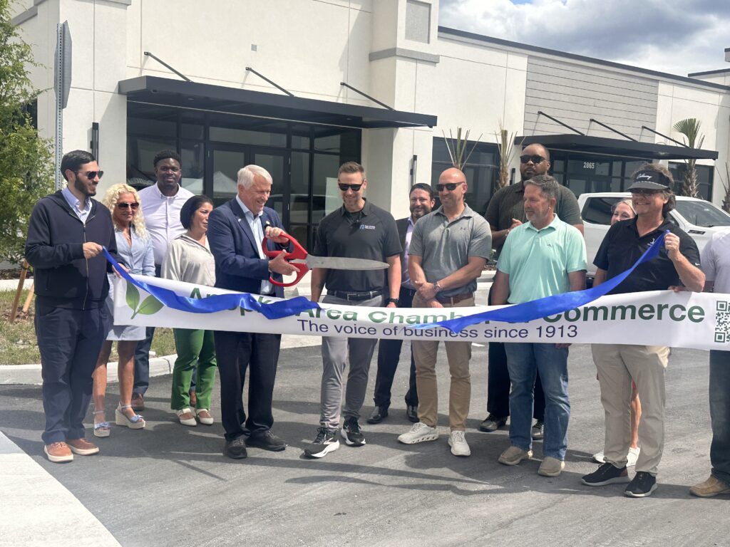 Officials cut the ribbon at Lake Carter Exchange in April. The project is part of the Shoppes at East Shore development, where a proposed 7-Eleven is under review by the Development Review Committee.