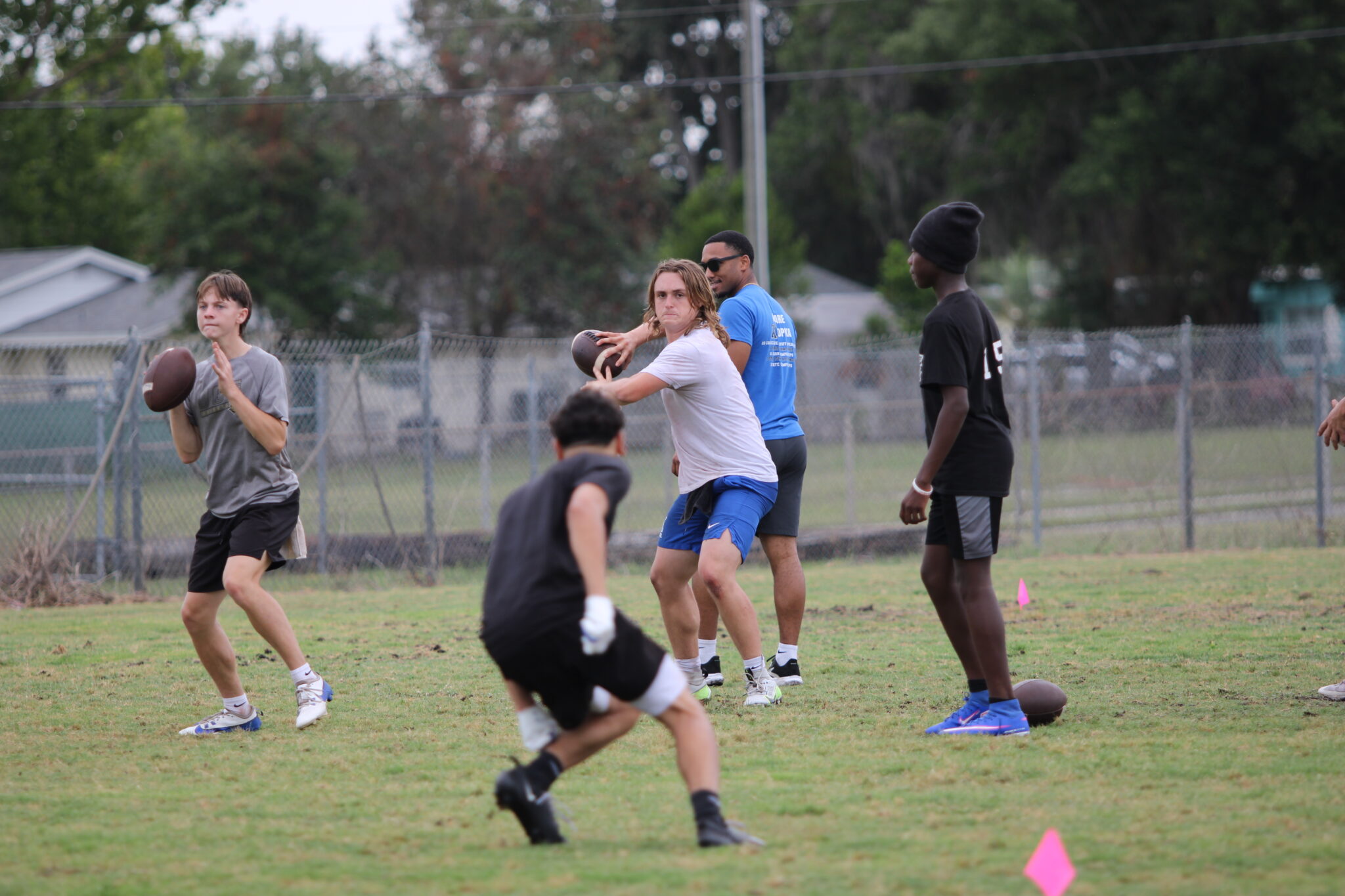 Junior Quarterbacks Brodie Bolly and Hunter McNenney work on their throwing mechanics.