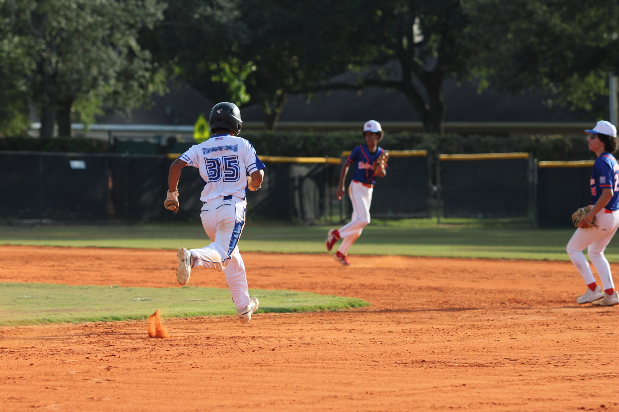 Maddox Thompson steals second base.