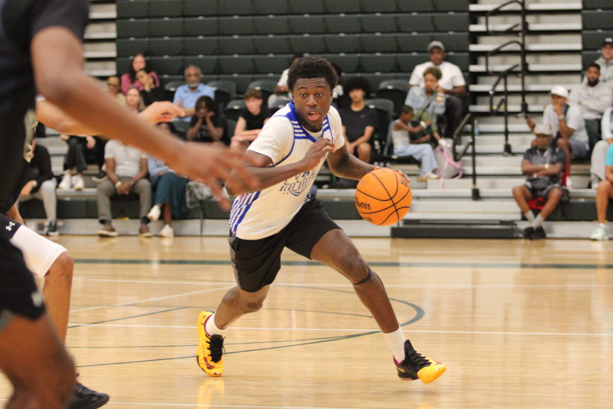 Noah Pratt tries to dribble past a defender.