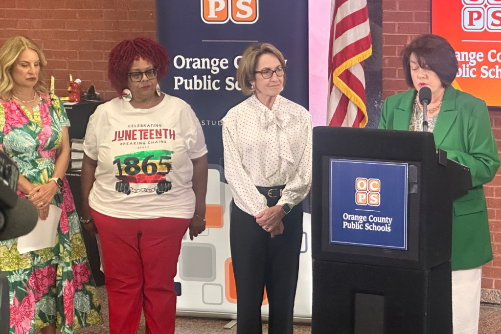 Orange County Public Schools Superintendent Maria Vazquez addresses the media at the Tuesday press conference at the Ronald Blocker Educational Leadership Center in Orlando as School Board members Angie Gallo (District 1) and Vicki-Elaine Felder (District 5) and School Board Chair Teresa Jacobs (L to R) watch.