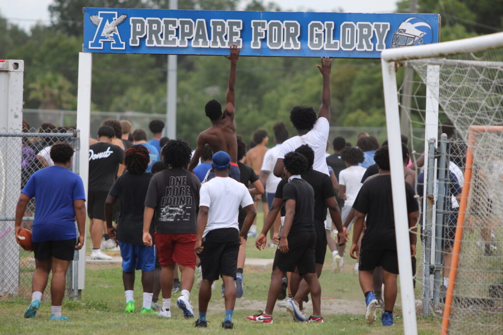Players head to the practice field for the open field, 7 on 7 part of Tuesdays workout.