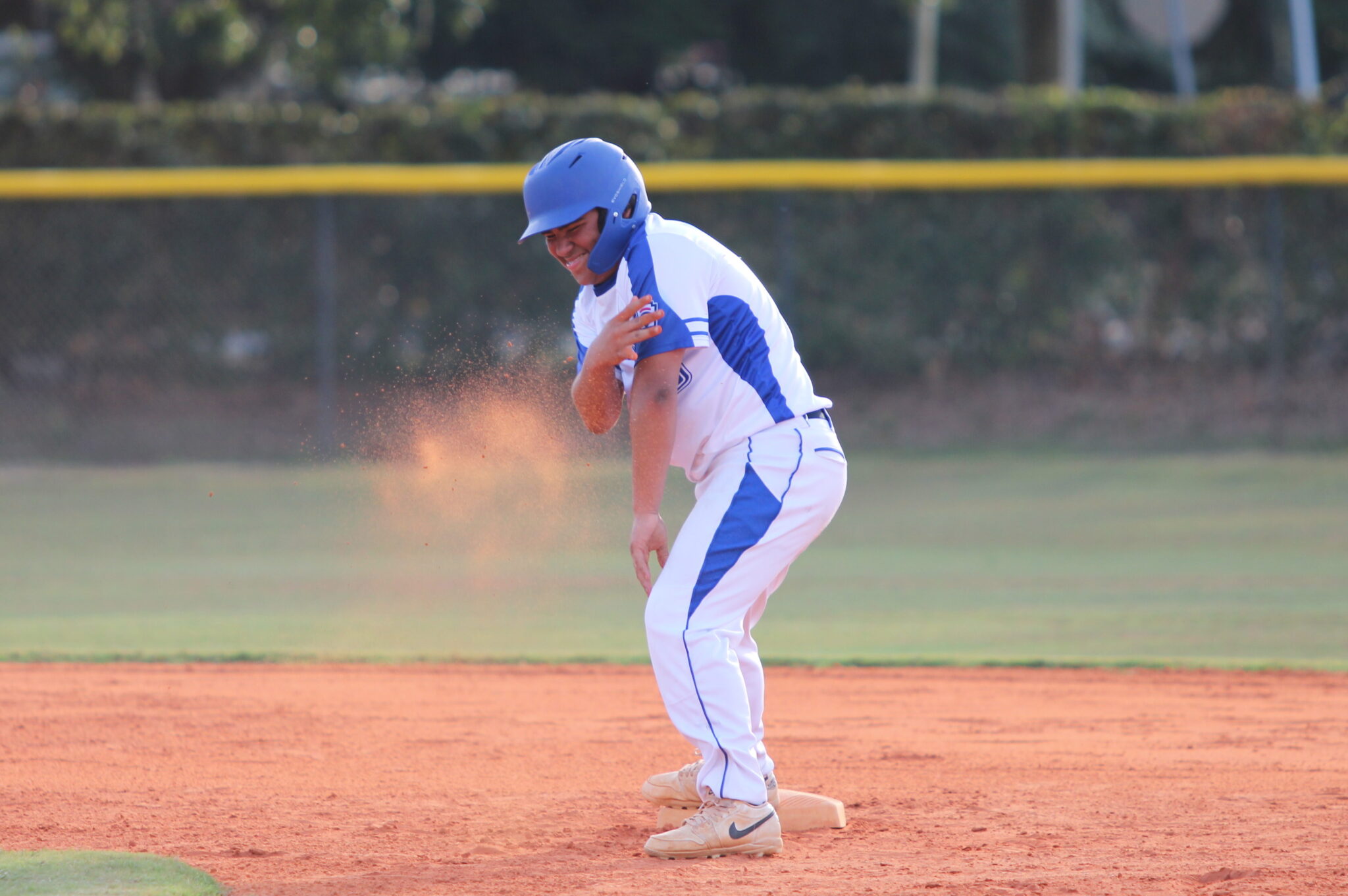 Sebastion Vasbinder chucks dirt toward his dugout to celebrate his rally igniting double in the second inning.