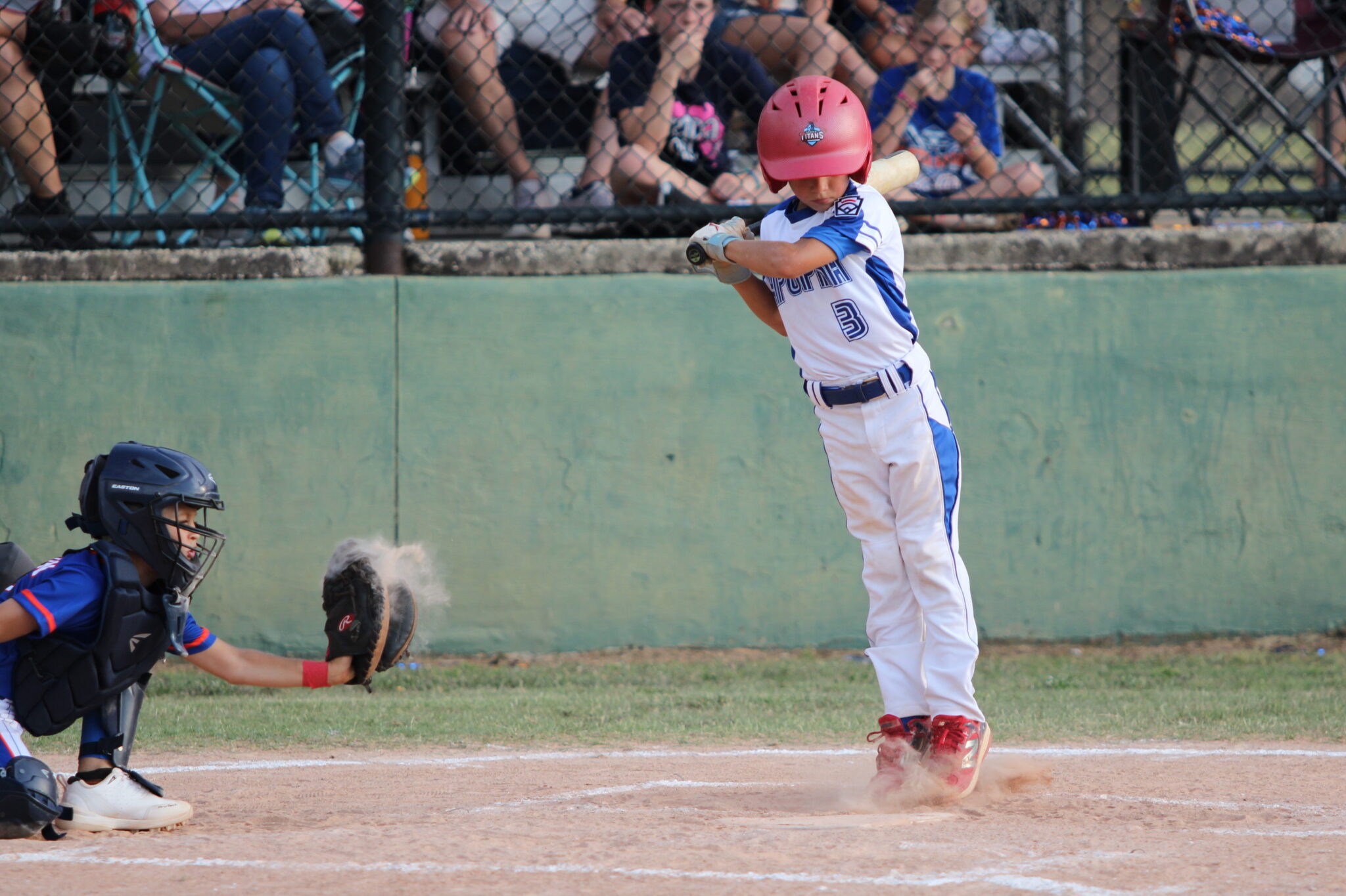 Tate Adams avoids an inside pitch.