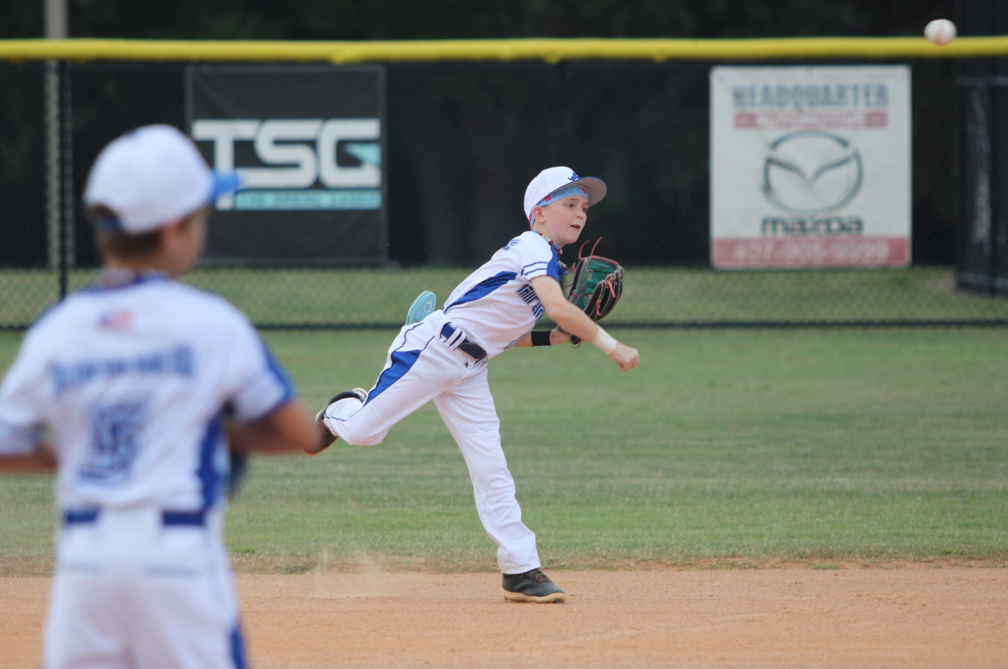 Tucker Little makes the play at second and throws to first base.