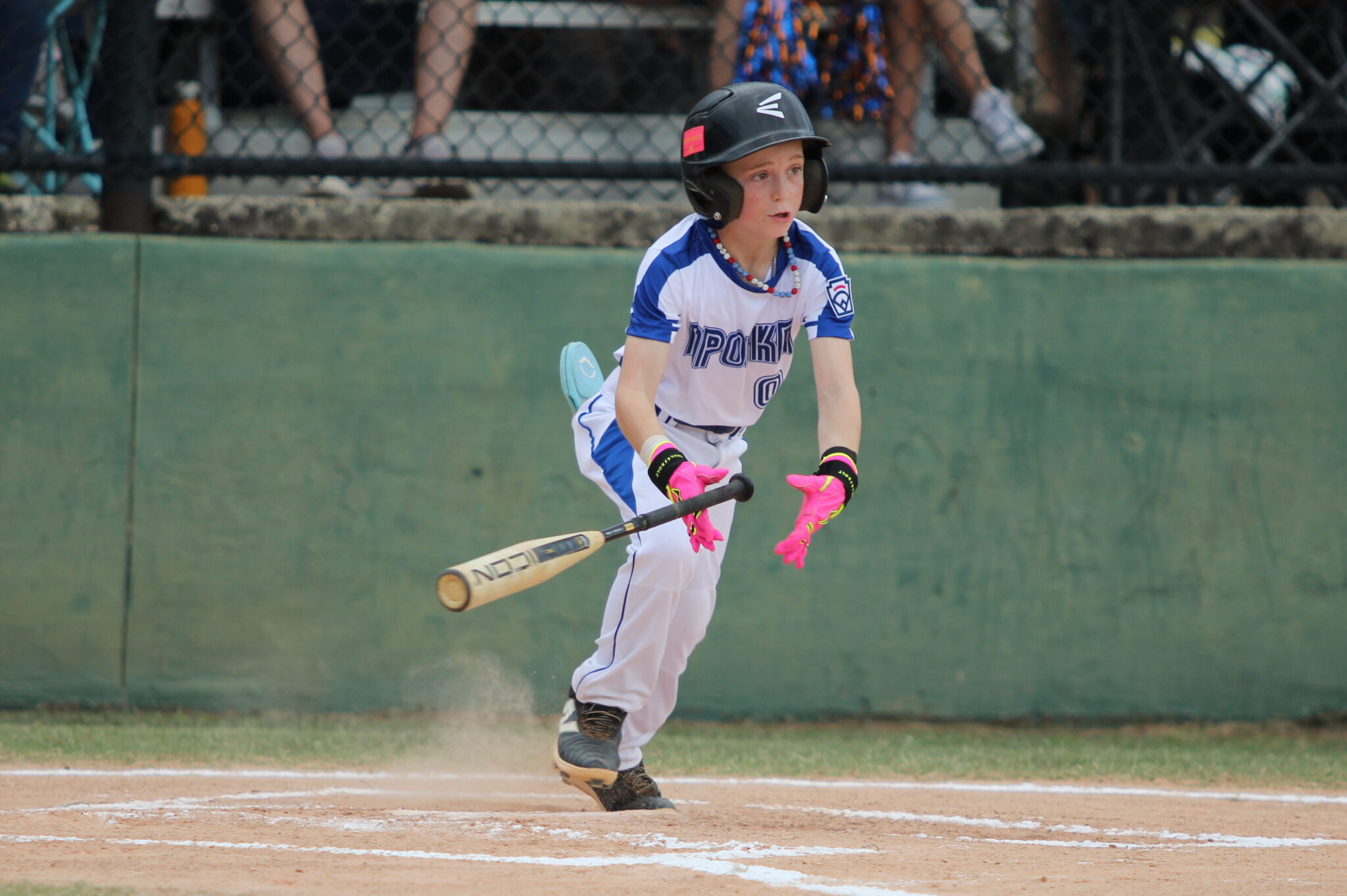 Tucker Little watches his hit in the first inning bounce in to second base.