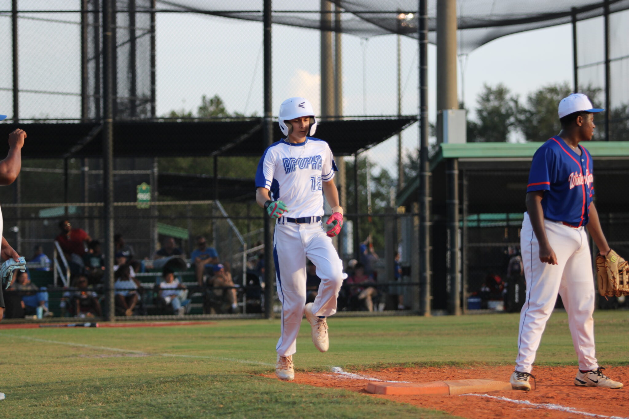 William Charlesworth crosses first base after his hit into the outfield.