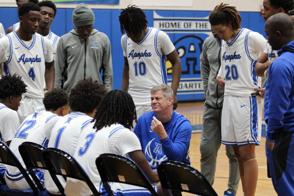 Blue Darters talk through the final timeout against East Ridge