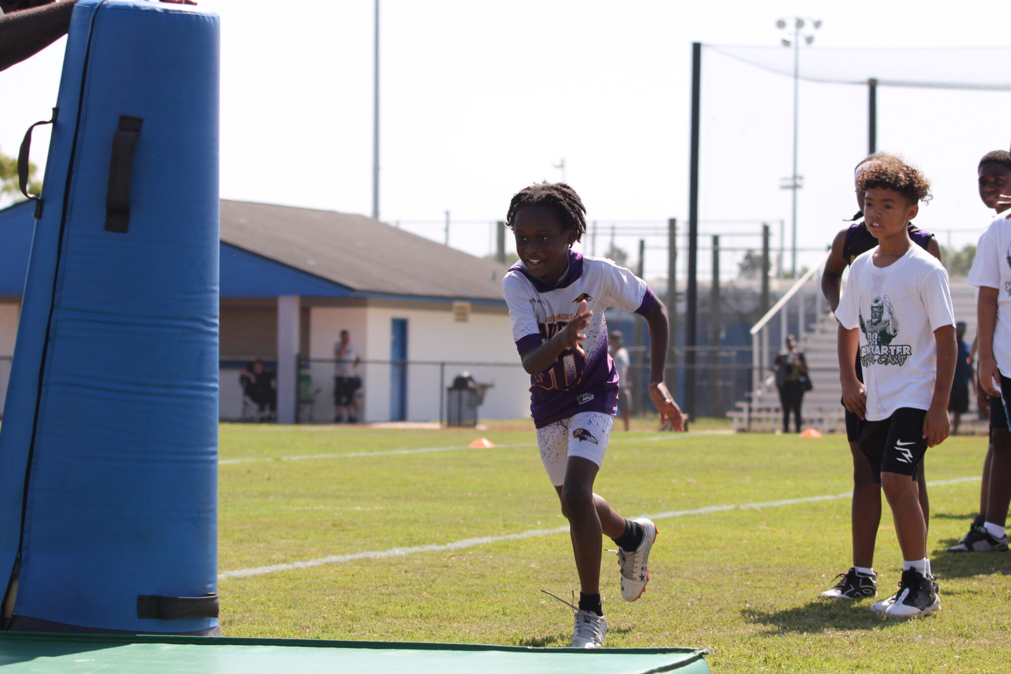 Camper bull rushes a dummy to spear through it.