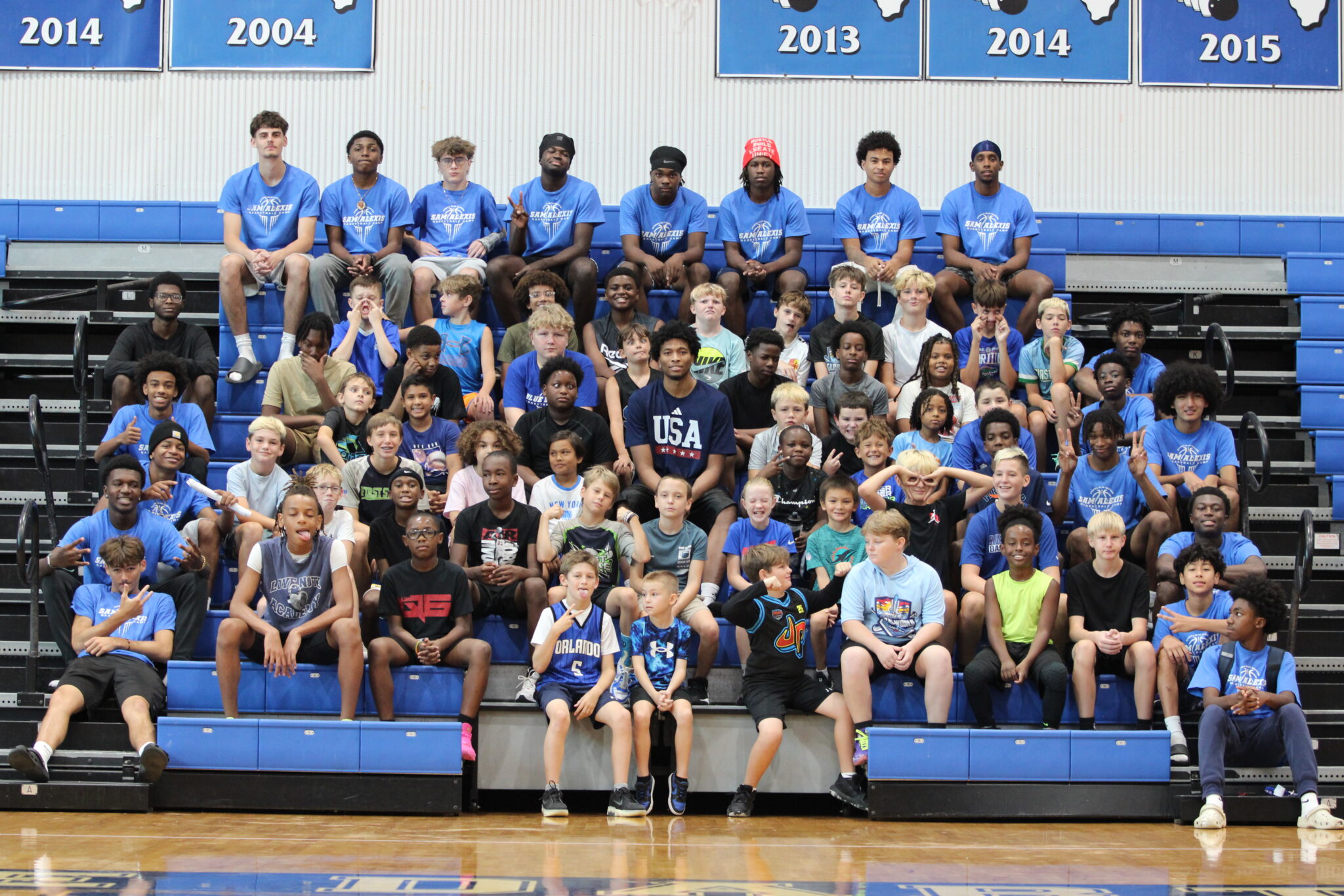Campers and coaches get together for a funny photo with Sam Alexis for the Sam Alexis Basketball Camp.