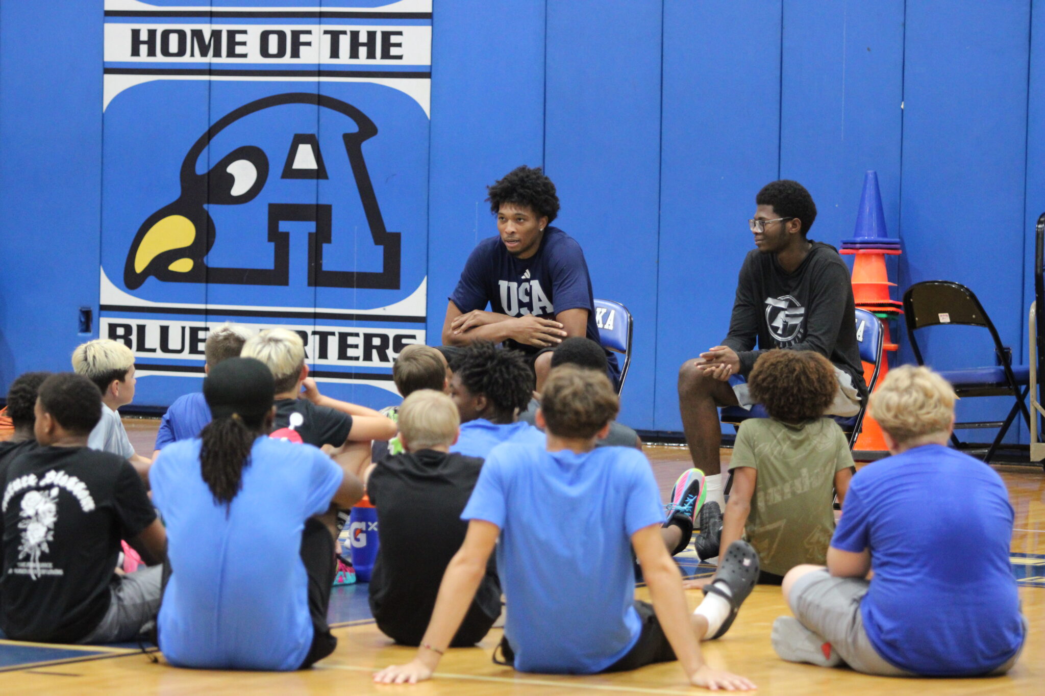Campers listen to Sam Alexis giving advice.