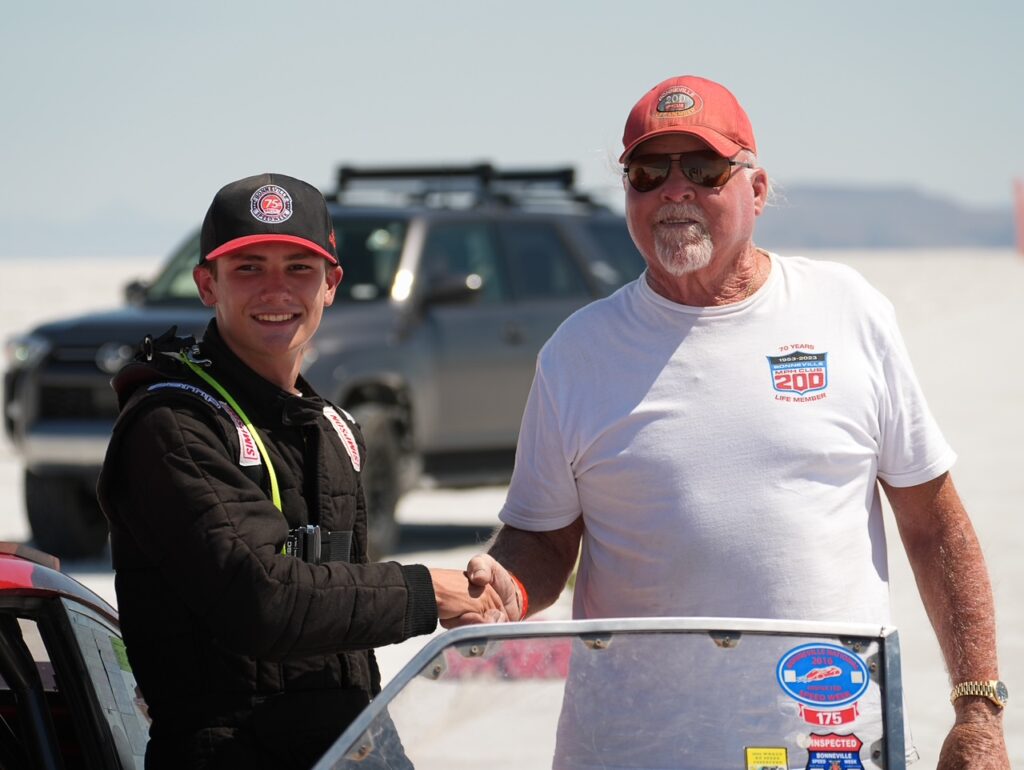 Carson May with his grandfather Red Stauffer after beating his land speed record.