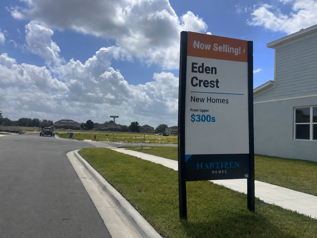 A sign advertises new homes at Eden Crest, one of several development-related items scheduled for review at the July 8 Development Review Committee meeting.