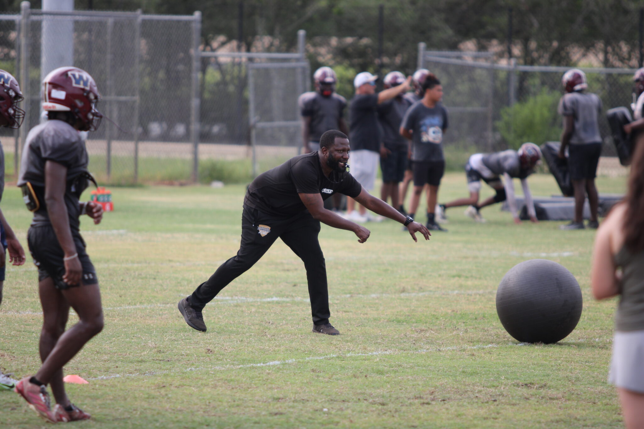 Defensive Coach Jerry Middleton drilling the defensive backs.