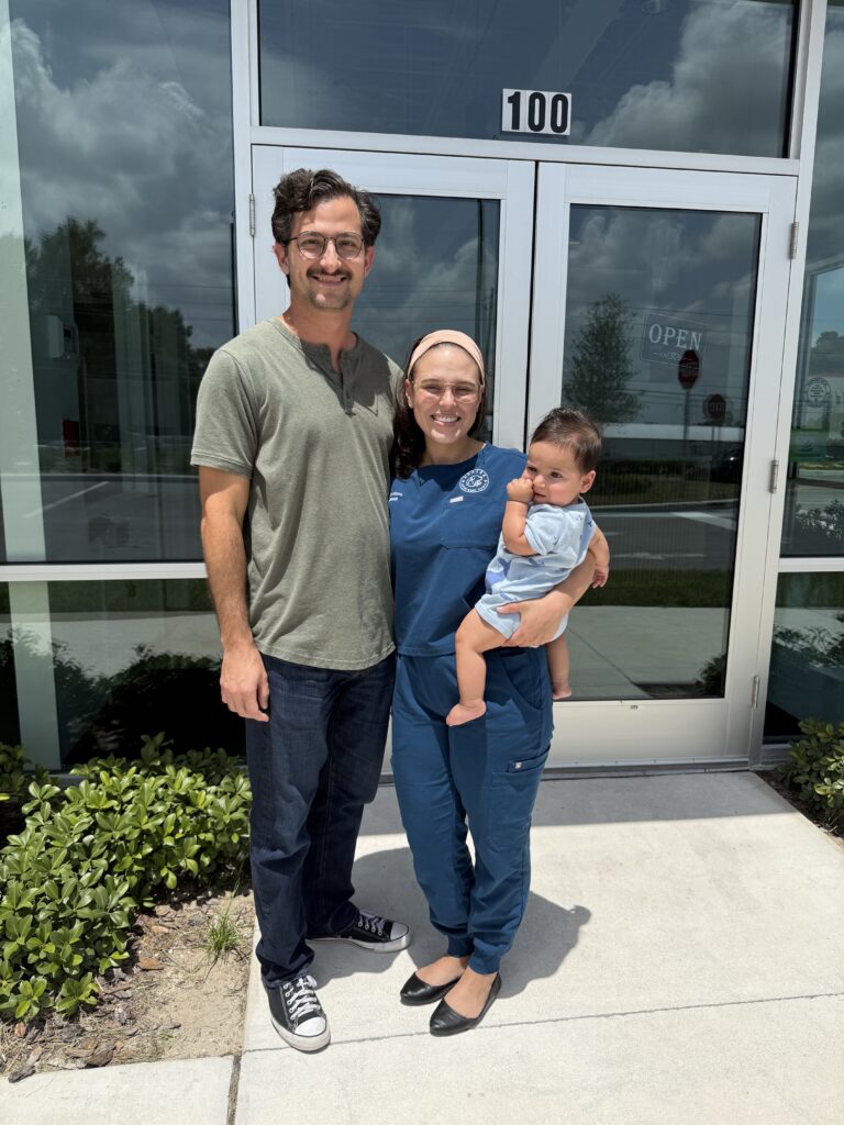 From left to right: Pascual Santiago-Martinez, Natalia Martinez and Joaquin Martinez stand outside Azalea Veterinary Clinic.
