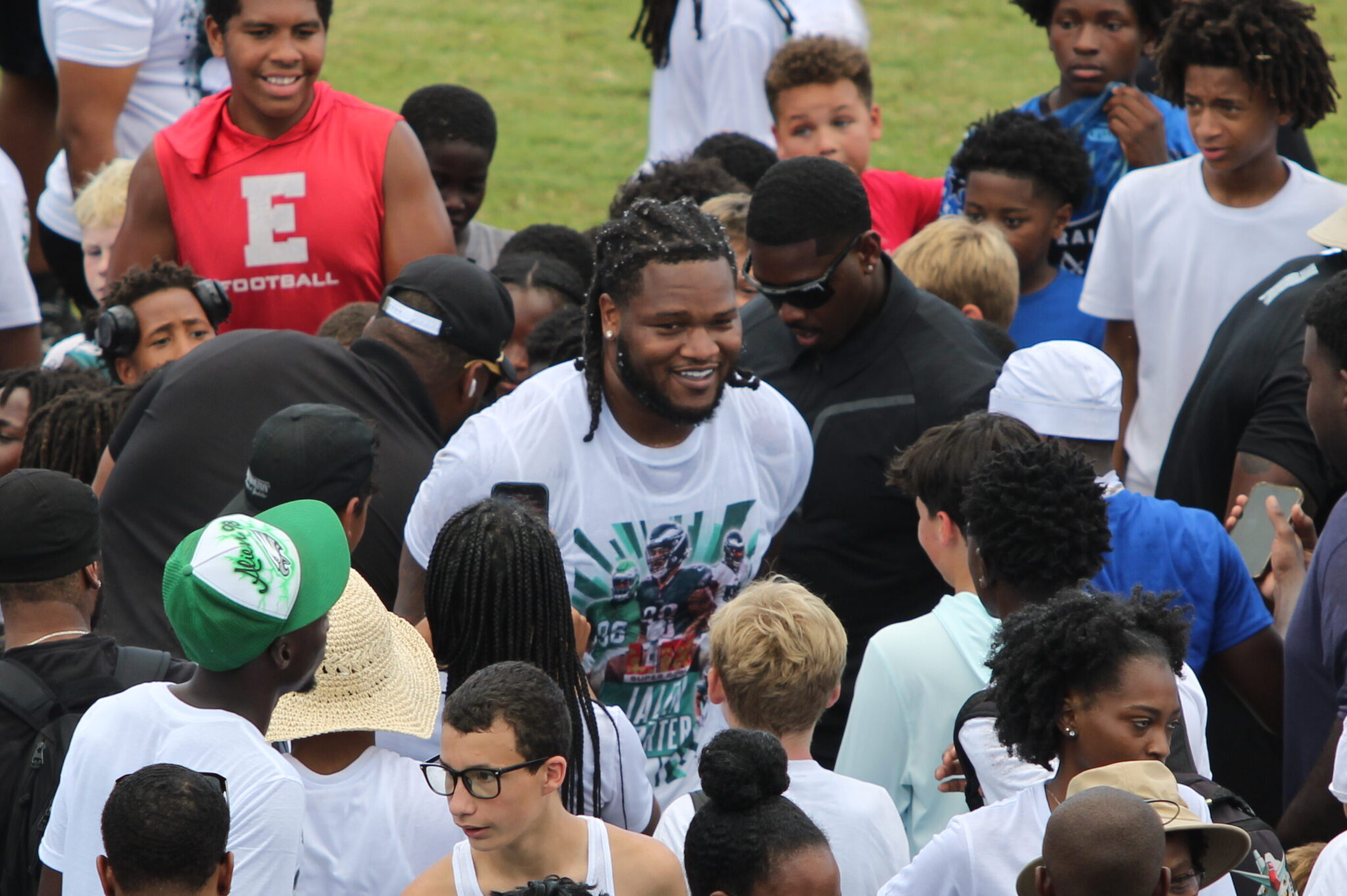 Jalen Carter in the crowd of his camp after being soaked by the ALS Ice Bucket Challenge.