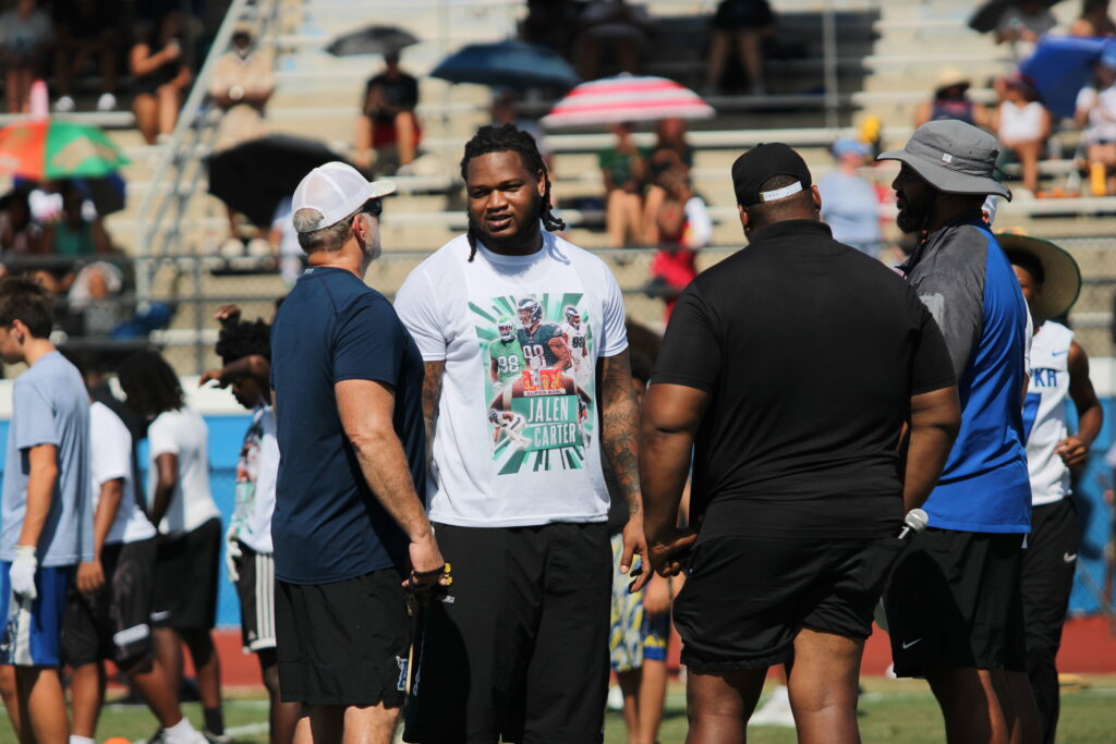 Jalen Carter talking with his old defensive coach Matt Anderson.
