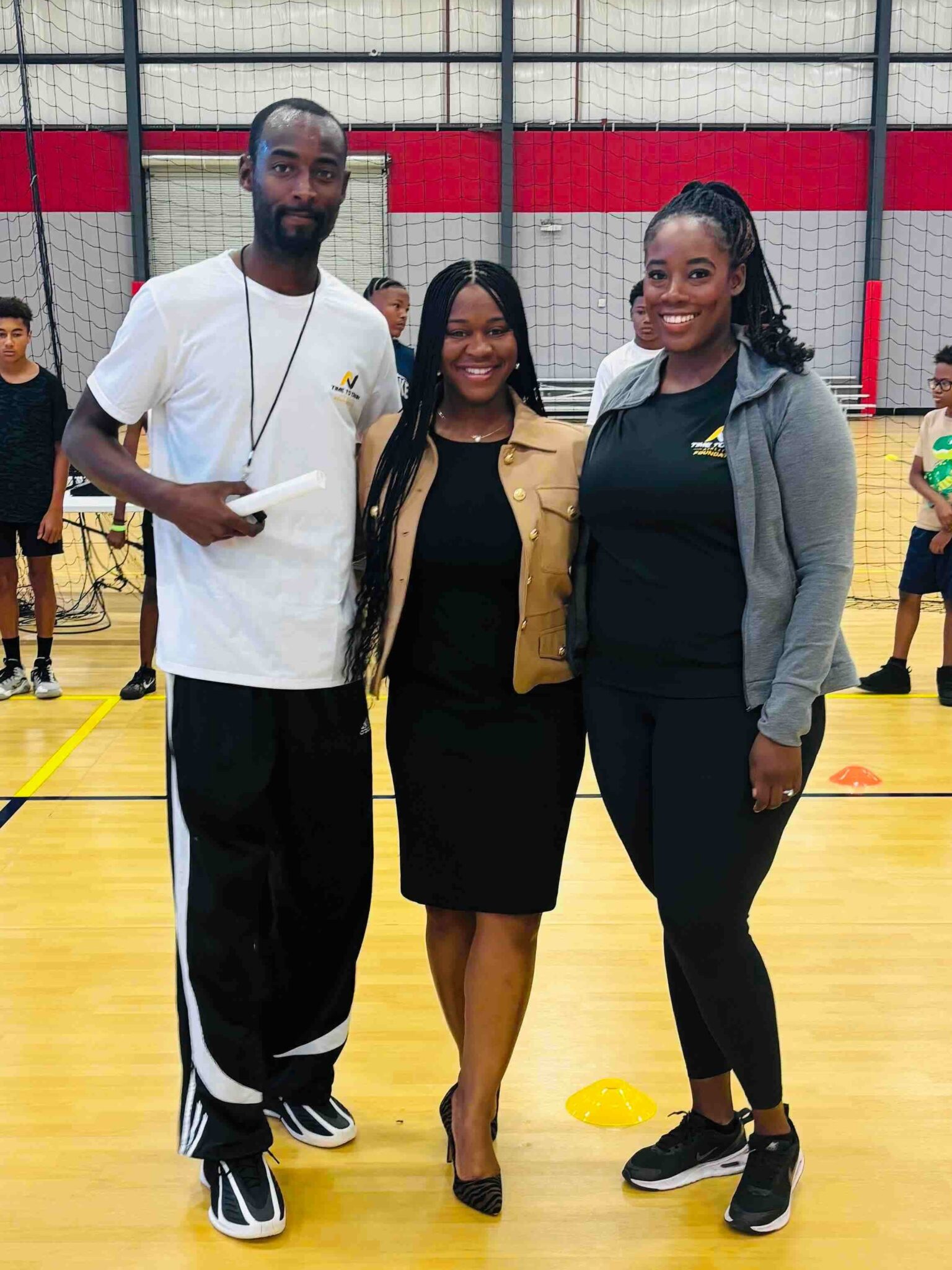 Jonathan and Johanne Thompson stand beside Apopka Commisioner Nadia Anderson at The Well Activity Center in Apopka.