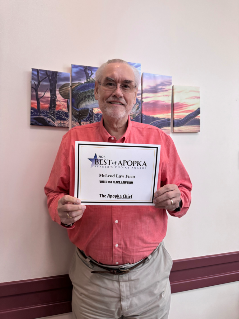 Raymond McLeod holds McLeod Law Firm's 2025 Best of Apopka certificate.