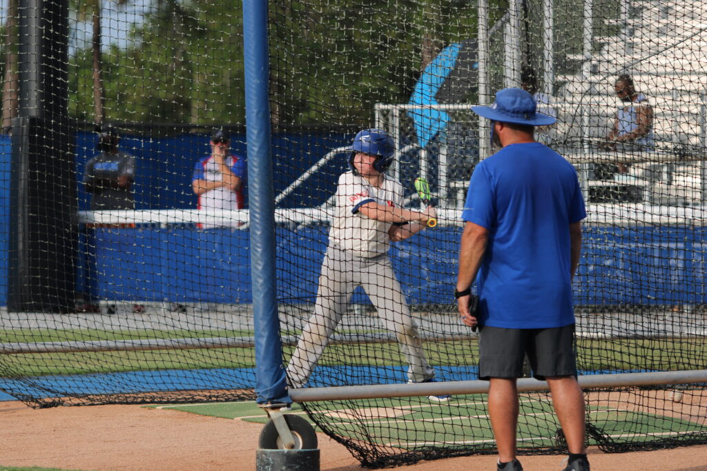 Scott Garland coaching technique at the plate.