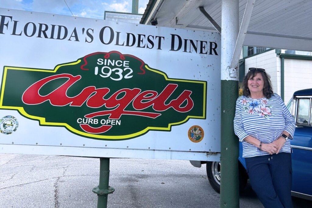 The author, Ronnie Lovler, stands outside Angel's Diner.