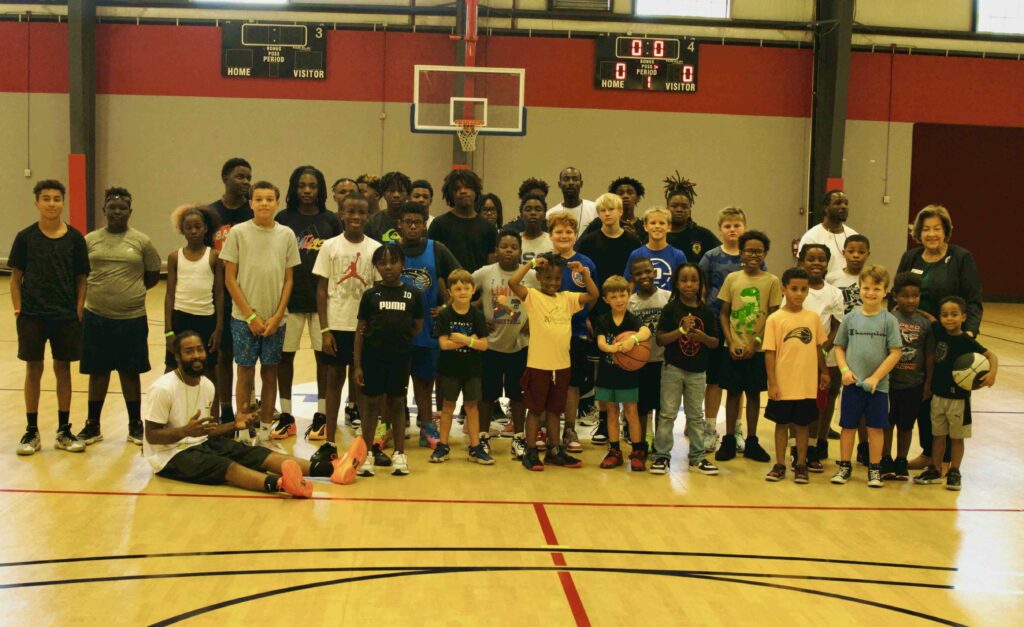 Time to Train Foundation team and camp participants assemble for a group photo at The Well Activity Center in Apopka.