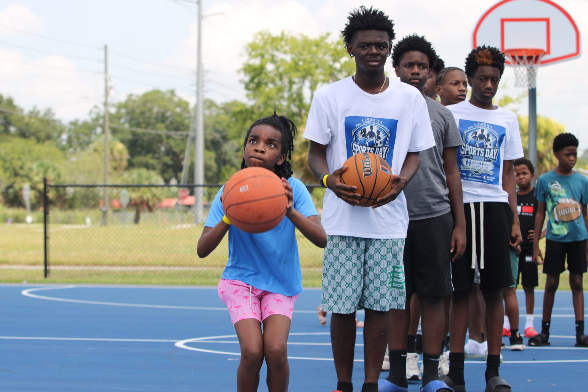 Young athlete focuses on hitting two free-throws to win a gift card in the free-throw shootout.