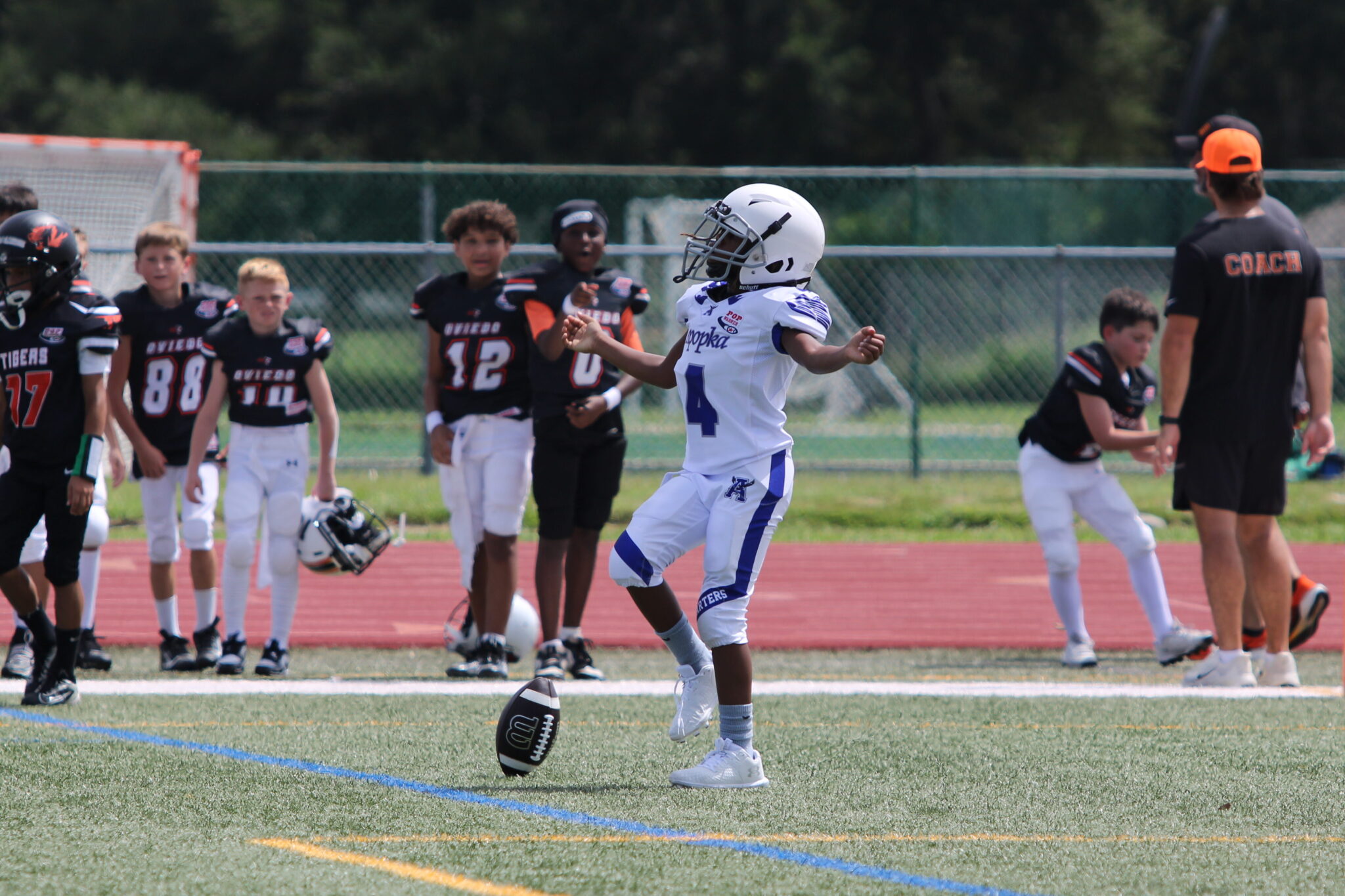 10u Blue Darter Liston Leonard runs last play of the offensive series 40 yards to the house and does his little dancy dance.