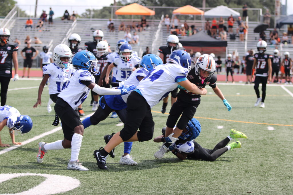 11u Blue Darters swarm the Oviedo ballcarrier.