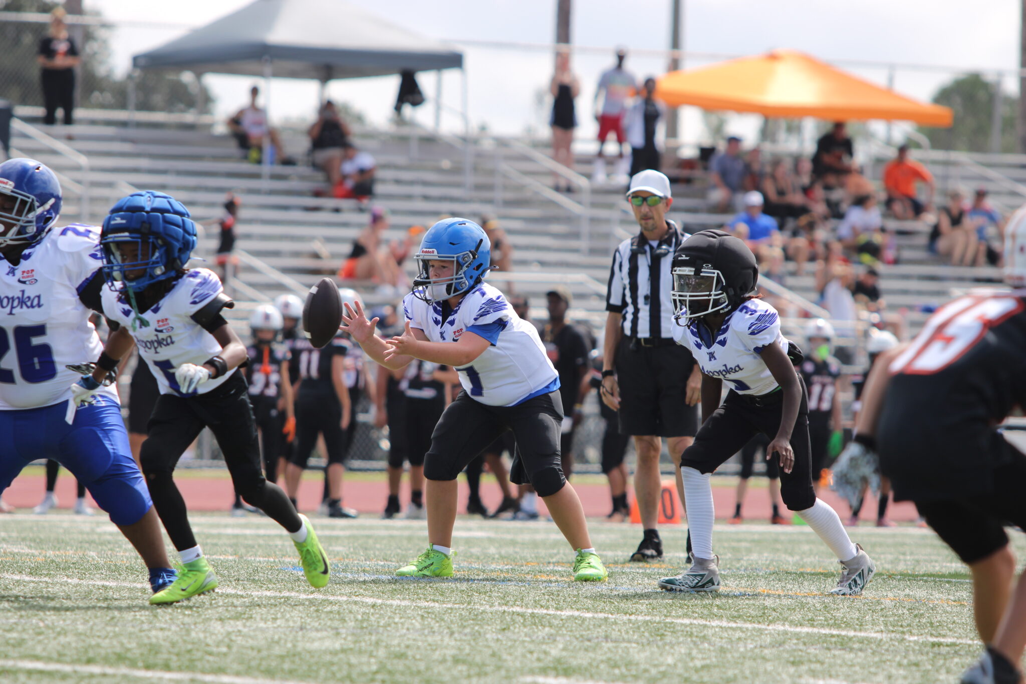 11u QB Grayson Maso takes the snap against Oviedo in Saturdays Jamboree.