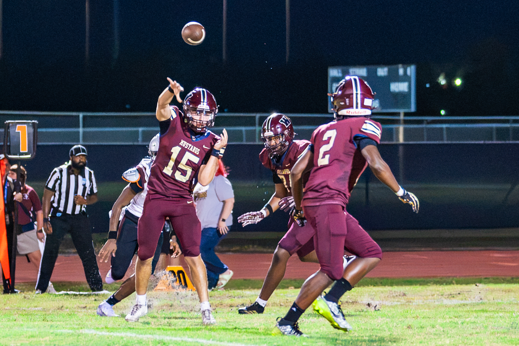 Dominick Sanguine passes to Bakary Manley during Wekiva's game against Cypress Creek Friday night.