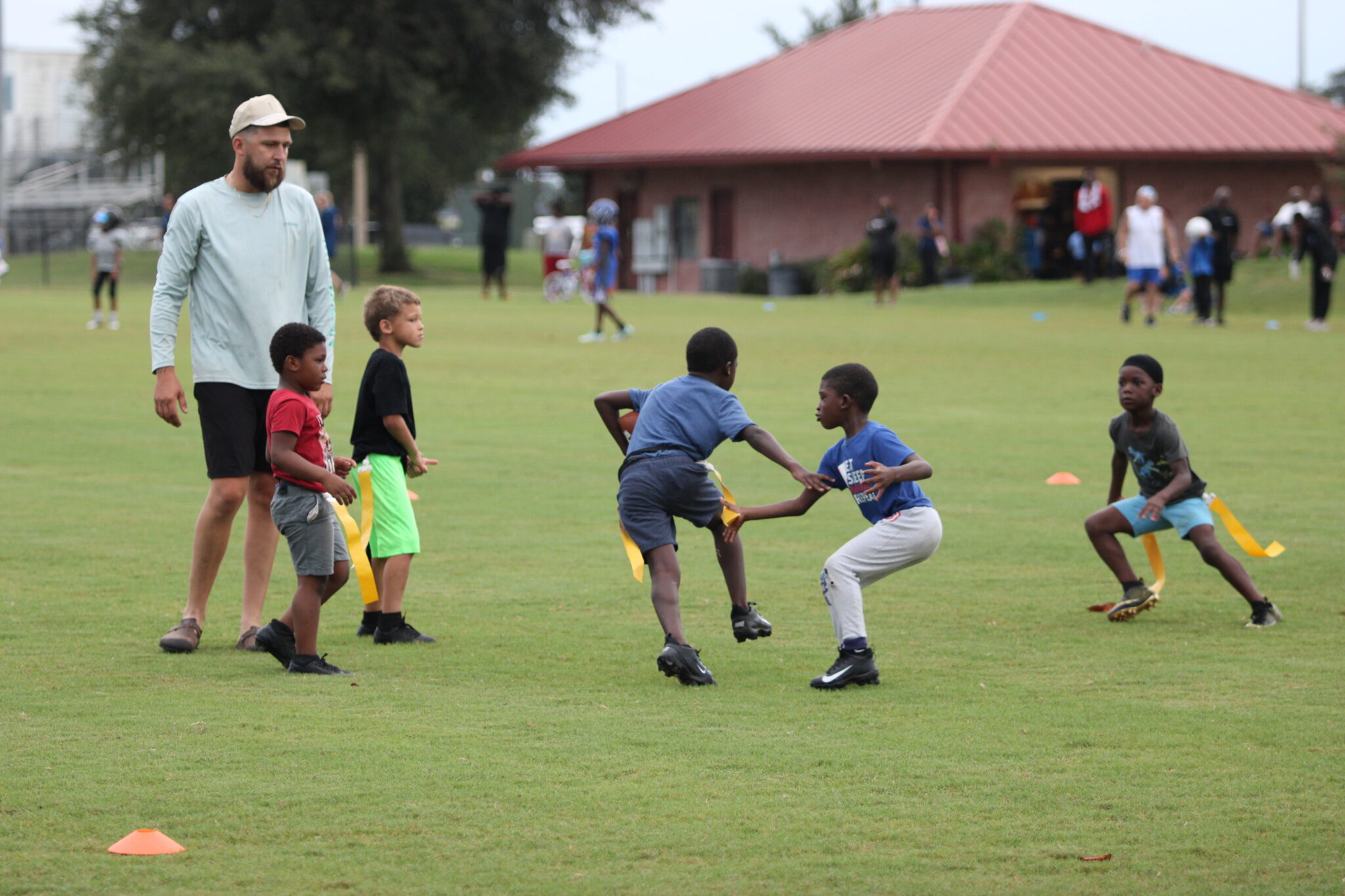 6u and 7u flag football practicing together.