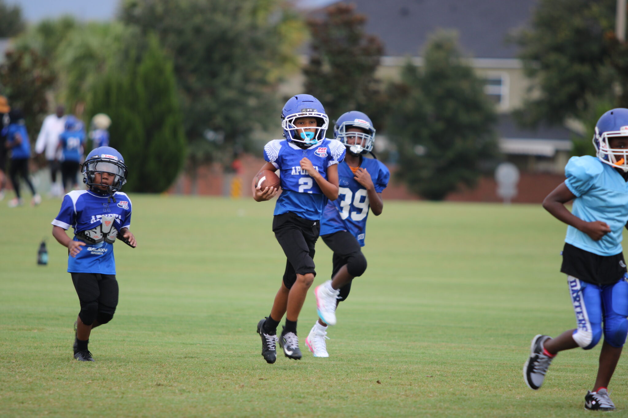 Apopka 8u hustle back to the huddle after a touchdown.