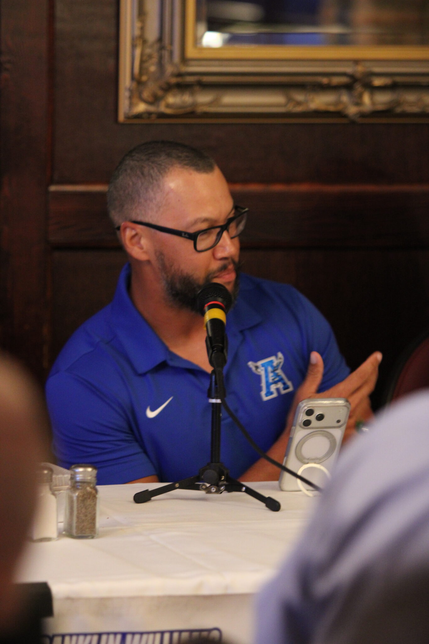 Apopka head coach Marcus Neeson takes his turn speaking in the Crying Towel event.