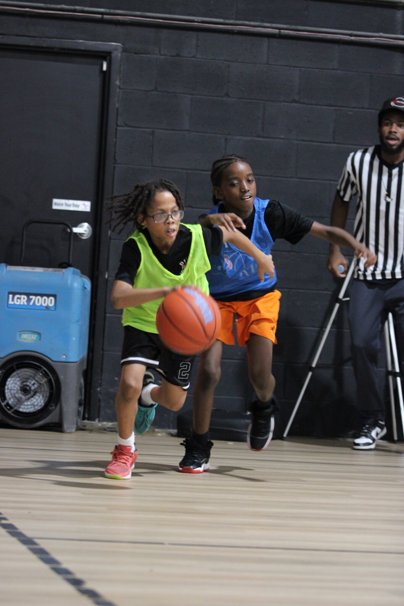 Camper dribbles past his defender in the scrimmage at the end of camp.