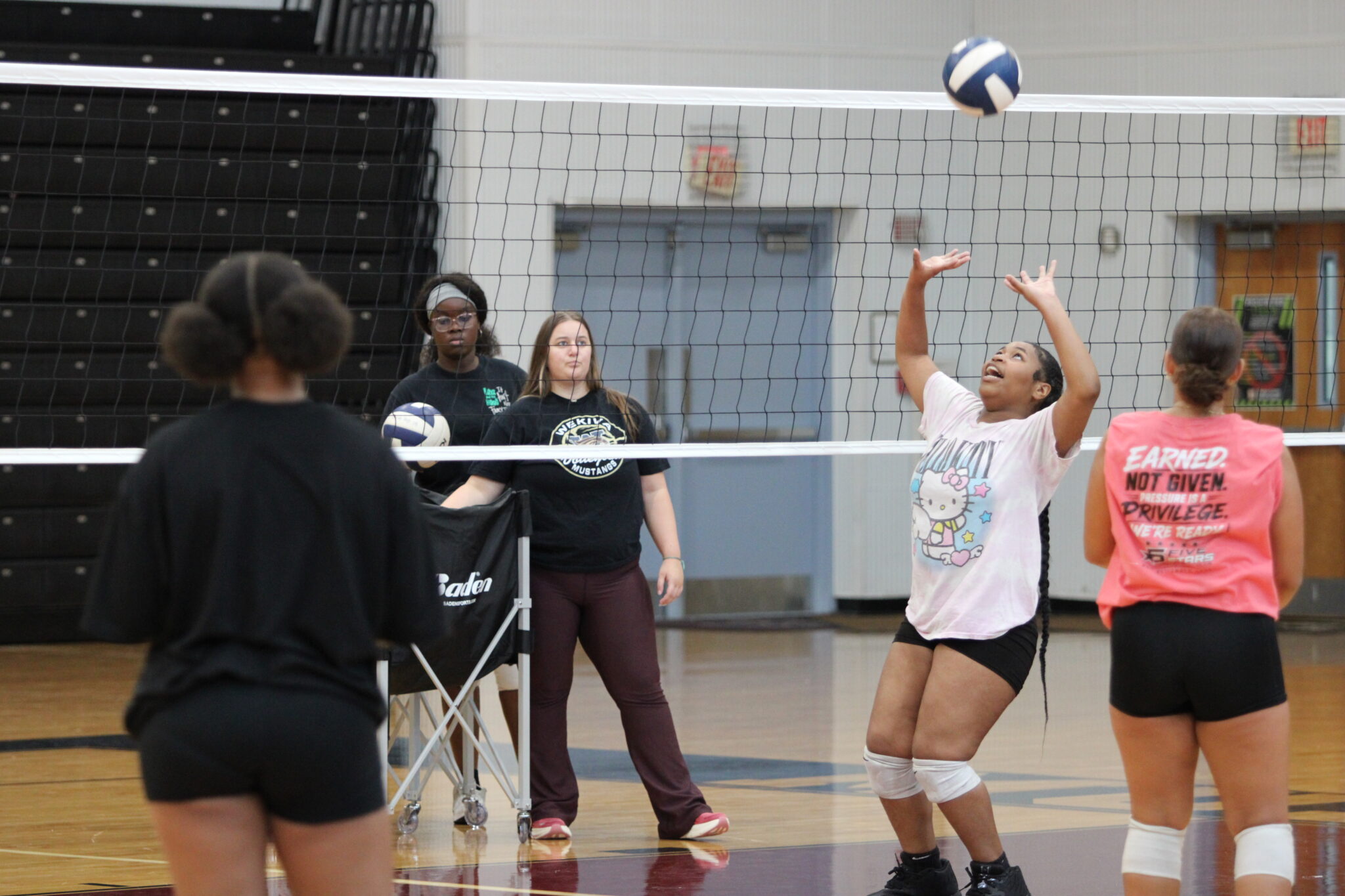 Coach Haley Stagg coaching up the Junior Varsity group.