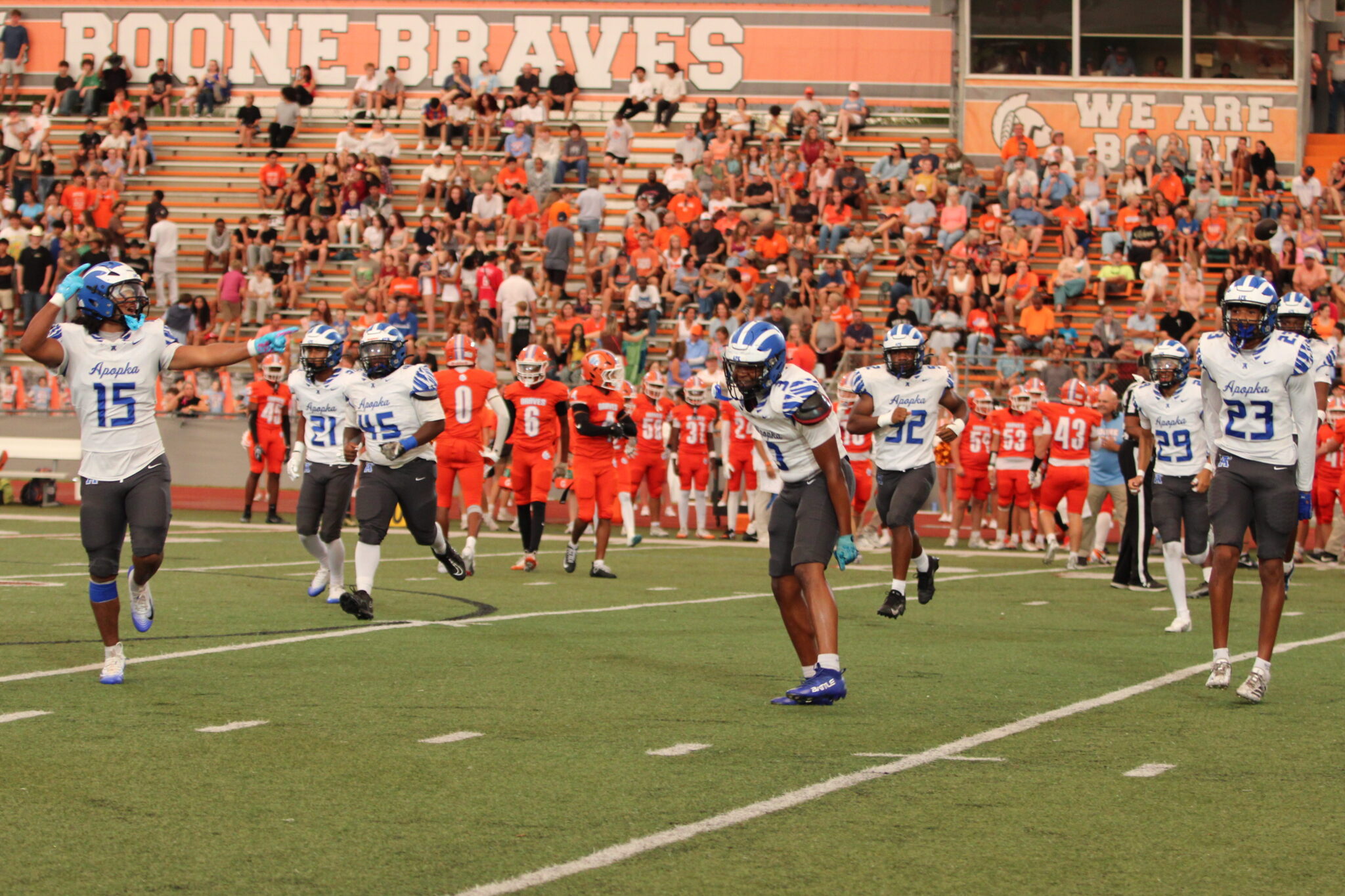 Defense runs off the field hyped over the early fumble recovery.