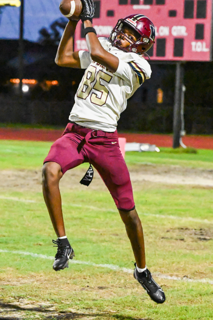Wekiva's Givanny Bufford hauls in a 28-yard touchdown pass in the second quarter of Friday's game against Lake Buena Vista.
