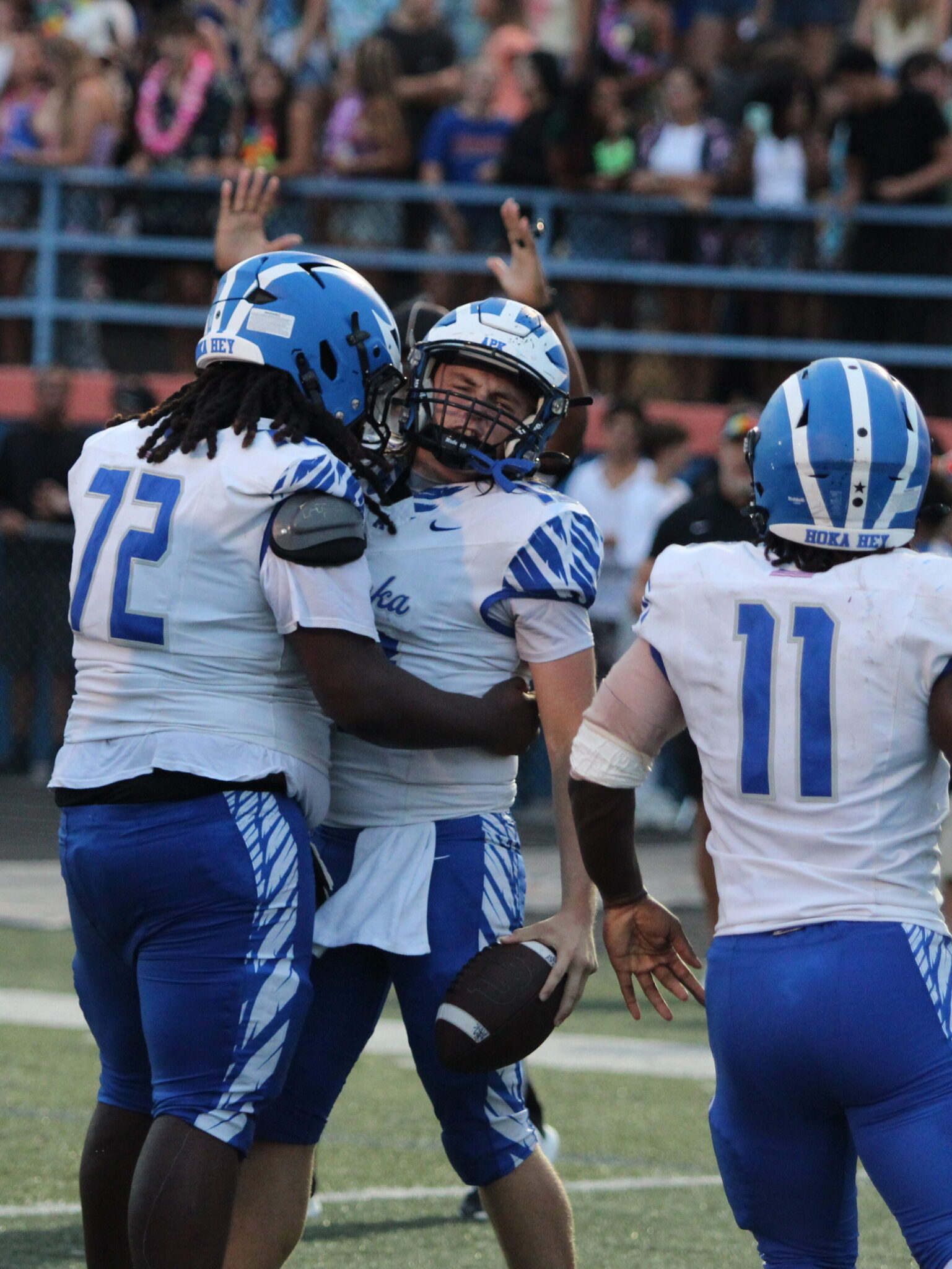 Hunter McNenney and center Gabriel McClendon celebrate after the rushing touchdown