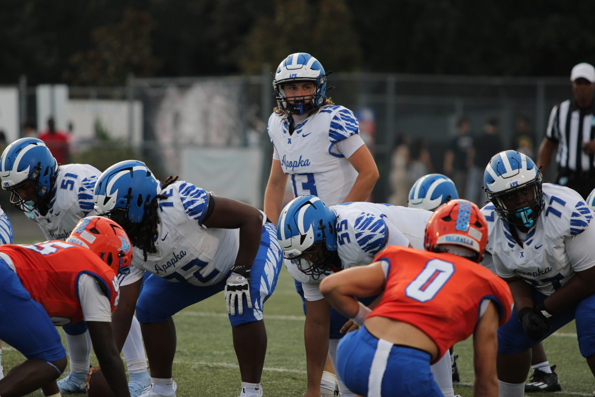 Hunter McNenney reads the West Orange defense in the first quarter.