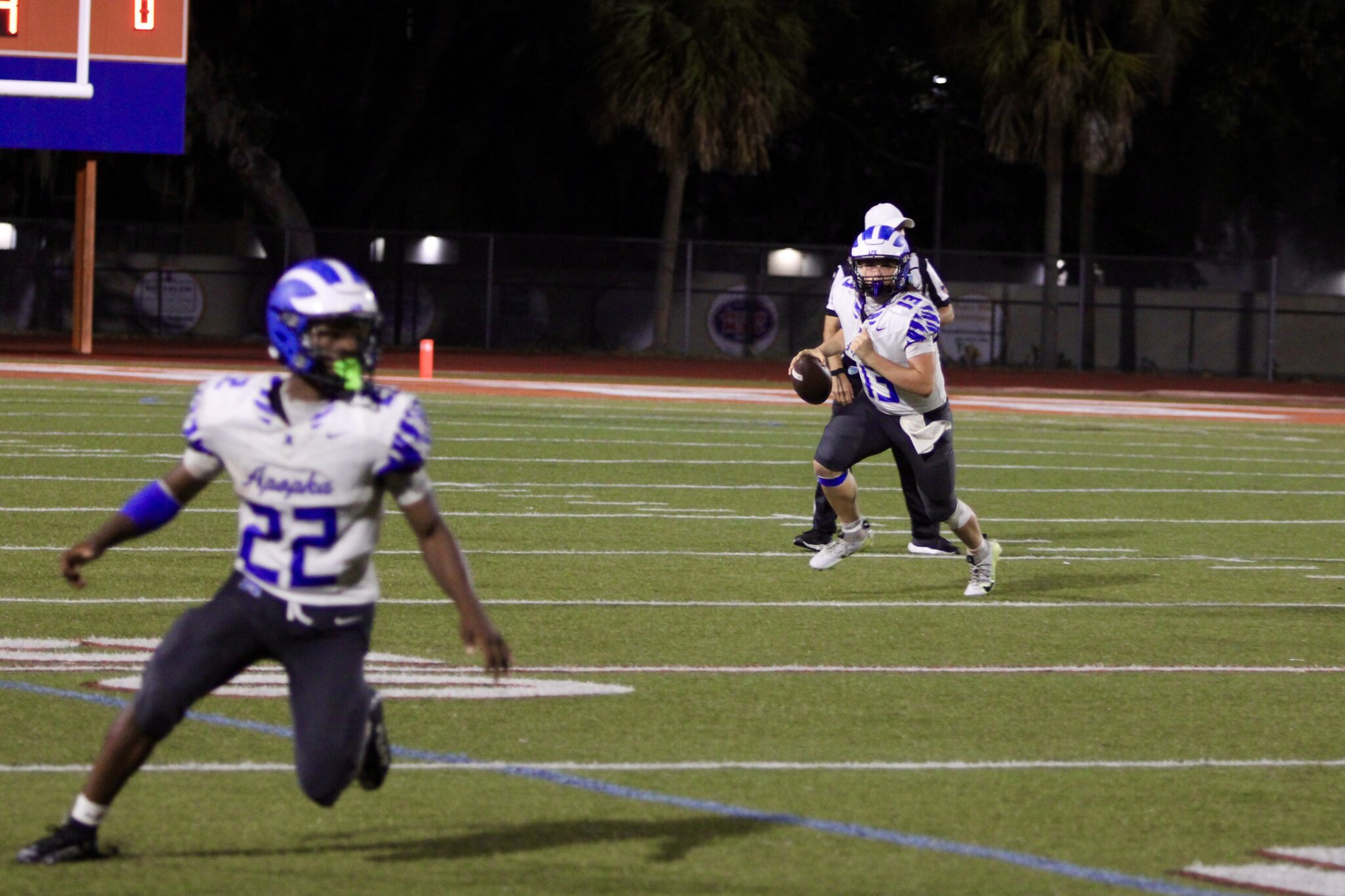 Hunter McNenney rolls out right and throws a dart to Jakyvion Kemp late in the fourth quarter.