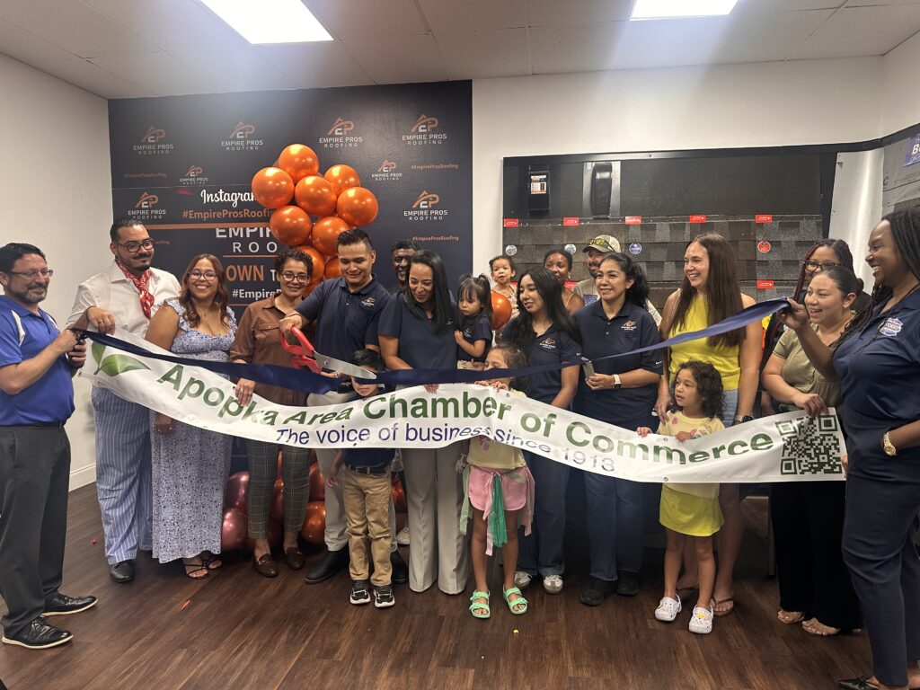 Representatives of Empire Pros Roofing, the Apopka Area Chamber of Commerce and community members gather for a recent Chamber ribbon-cutting ceremony at the business. The Chamber is working to expand events and increase engagement with member businesses as it rebuilds following a leadership dispute last year.