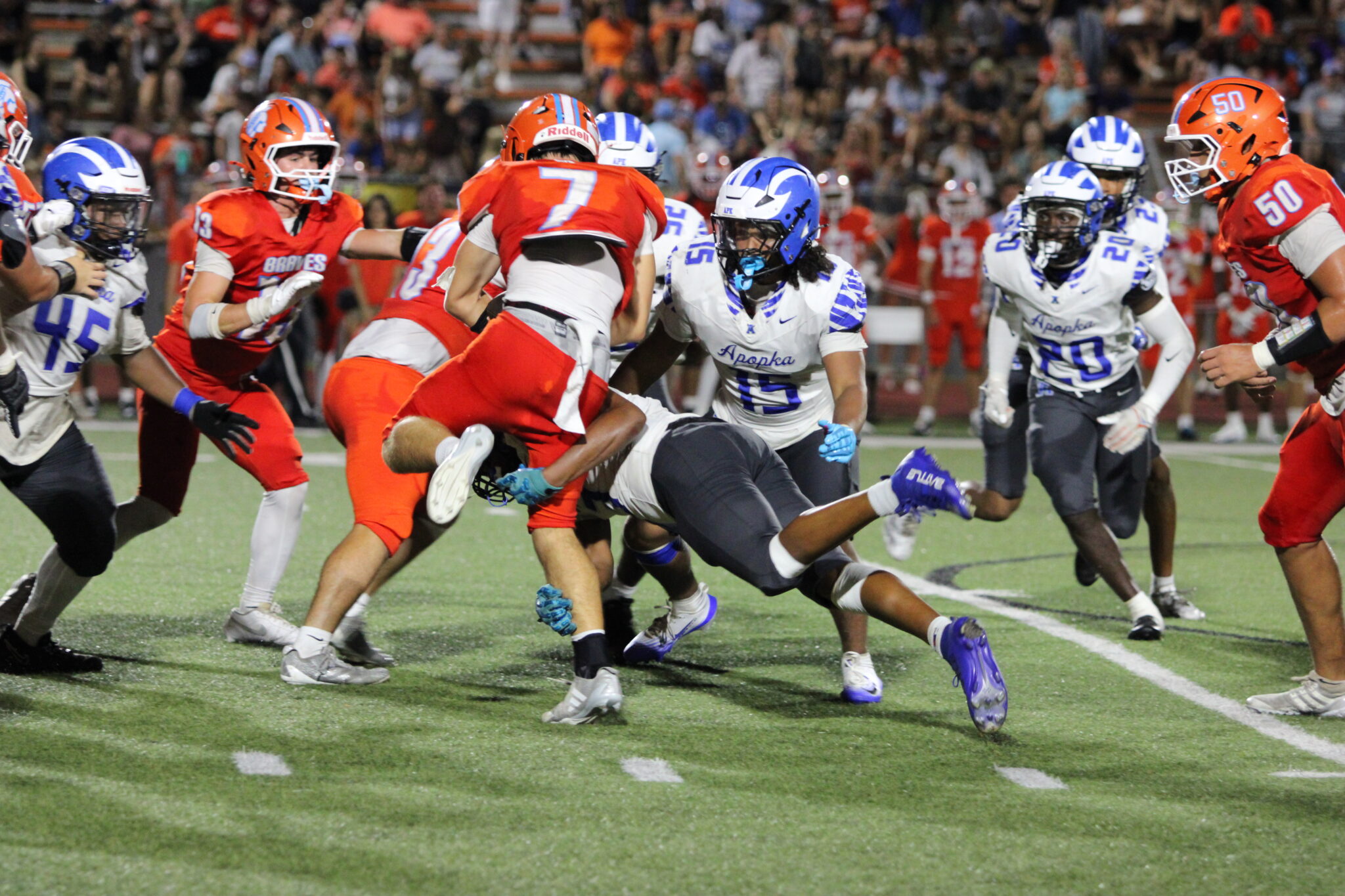 Jakendall Kemp spears through a Boone ball carrier as Jayden Caban cleans up the tackle.